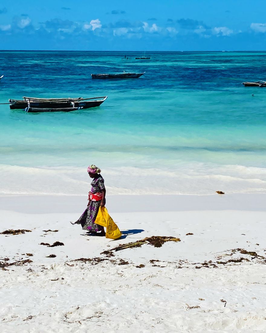 Woman walking along the shoreline